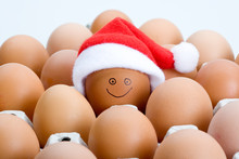 Brown Eggs And A Santa Hat, Isolated