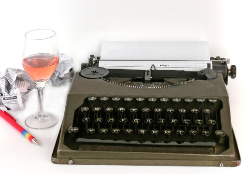 A vintage typewriter with crumpled pieces of paper
