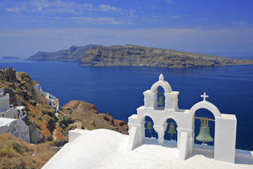 Wall Mural - Church bells in Oia village on Santorini island, Greece