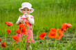 canvas print picture Baby-girl with red flower