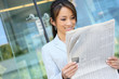 © Stephen Coburn - Asian Business Woman Reading Newspaper