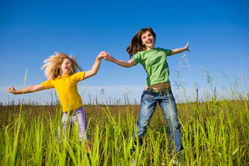 Wall Mural - Happy mother and daughter on field