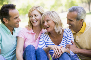 two couples outdoors smiling