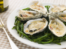 Grilled Oysters With Mornay Sauce On Samphire