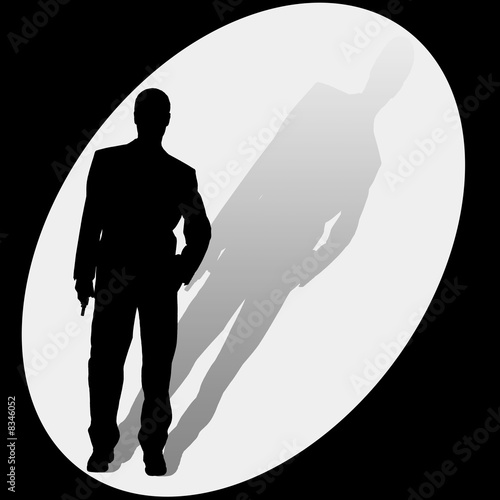 male ith gun in spotlight Canvas Print