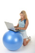 © Ken Hurst - Woman Using Exercise Ball Desk