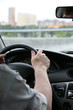 man holds a steering wheel of the car