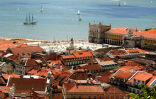 Bird Way Of Central Lisbon With Red Roofs And River Embankment