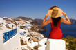 Beautiful young Greek woman on the streets of Oia, Santorini, Gr