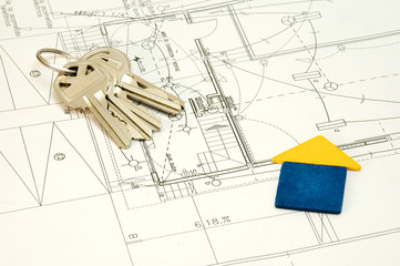 house and keys over some technical drawing