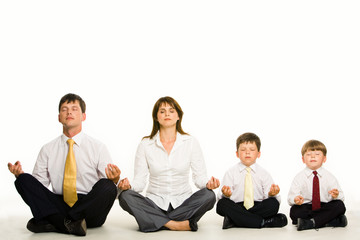 Canvas Print - photo of friendly family sitting in pose of lotus in a row