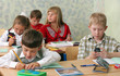 © Tatiana Belova - Pupils at classroom