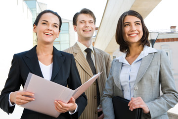 Sticker - Portrait of business team outside looking straight