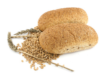 two breads and wheat isolated on white