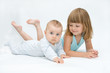 © Renata Osinska - little brother and sister playing together, on white
