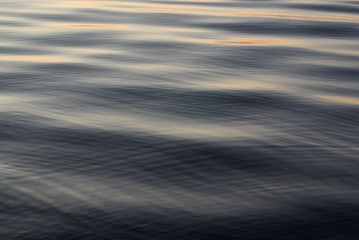  Water surface with small waves at sunset