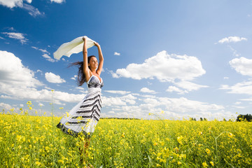 Image of happy woman holding a white fabric