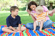 © Stephen Coburn - A mother and sons having fun while playing in the park