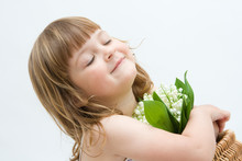 Little, Pretty Girl Holding Bunch Of Lilies Of The Valley