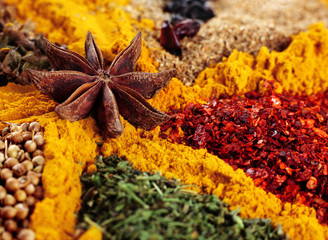 Mix spice background with anise star and curcuma closeup