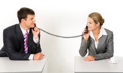 Canvas Print - Portrait of business partners speaking on the telephone