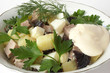 Salad with meat, a boiled potato, boiled eggs and prunes