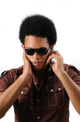 Wall Mural - Portrait of young trendy african male using a cell phone