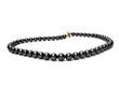 black  pearl necklace on white background