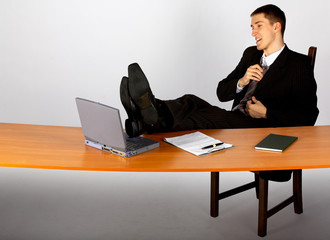 Wall Mural - businessman in suit and tie with laptop