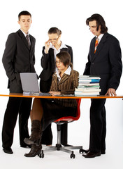 business team with laptop and books near the table