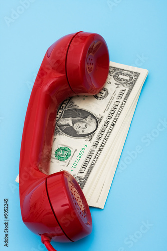 Obraz na plátne Telephone with money – call for help with your finances