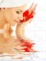 Wall Mural - puzzle of lovely woman with red flower petals in water