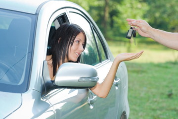 Beautiful teen-ager receiving car keys