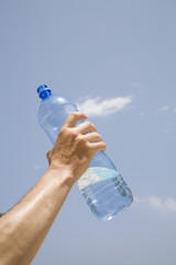  Mineral water in bottle on blue sky background