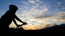 Biker Girl Silhouette In Sunset