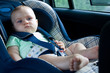 © Renata Osinska - little baby sitting in safety car seat