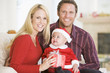 © Monkey Business - Couple With Baby In Santa Outfit