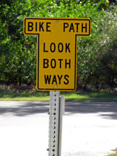 A Bike Path Sign Look Both Ways