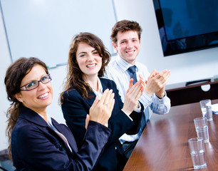 Poster - Happy businesspeople clapping on business training