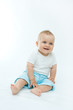 © Renata Osinska - cute laughing baby boy sitting on white background