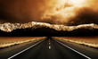 canvas print picture Long straight road heading to stormy mountains