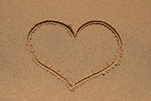 Heart Symbol Drawn In The Sand Beach.