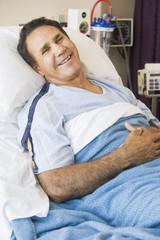 Wall Mural - Middle Aged Man Lying In Hospital Bed