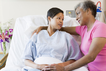 Wall Mural - Mother And Daughter Looking At Each Other In Hospital