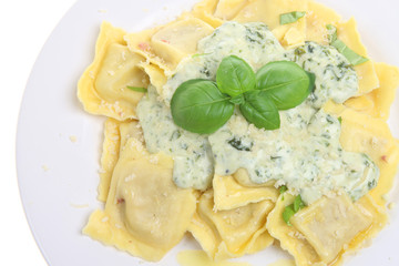 Wall Mural - Ravioli pasta with a spinach and cheese sauce