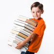 © pressmaster - Portrait of handsome pupil with huge pile of books