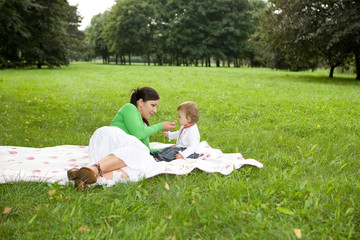 Canvas Print - happy family on green meadow