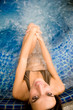 © EastWest Imaging - A young attractive woman in a spa pool