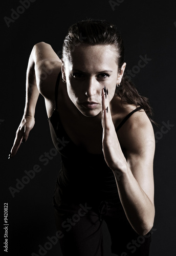 Nowoczesny obraz na płótnie woman running over dark background