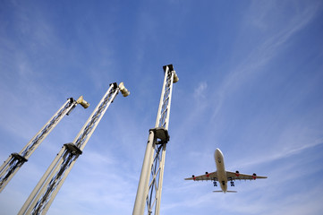 Wall Mural - A plane is going to land in an airport.